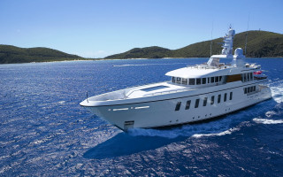 Large white boat ocean mountains - feature free wallpaper