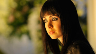 Woman black jacket serious look - a black jacket free wallpaper