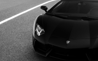 Black sports car driving white - a white line free wallpaper