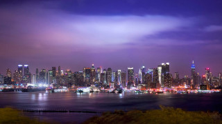 City skyline tall buildings water 2 - a purple sky free wallpaper