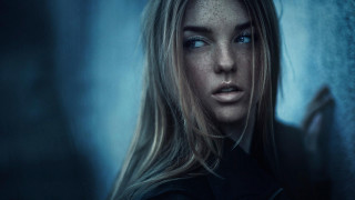Serious woman long hair blue 2 - freckle free wallpaper