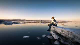 Person sitting overlooking ice floes - ice flo free wallpaper