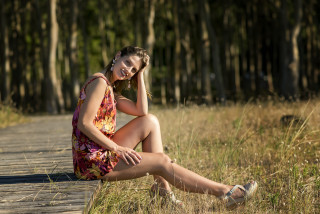 Woman sitting wooden walkway grass - fashion photoshoot free wallpaper