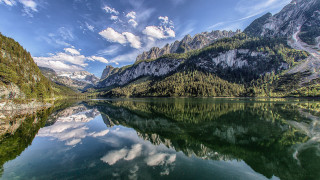 Mountain lake forest hillside sky - a mountain lake free wallpaper