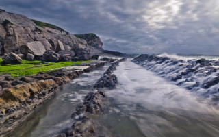 River rocks beach grass cliff - a green grass free wallpaper