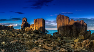 Rocky beach blue sky clouds - blue free wallpaper