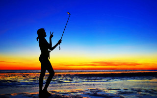 Woman beach fishing sunset vibrant - the sun setting free wallpaper