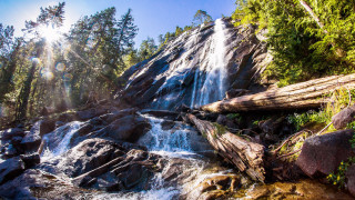 Waterfall forest rocks sunlight nature - free mountains wallpaper