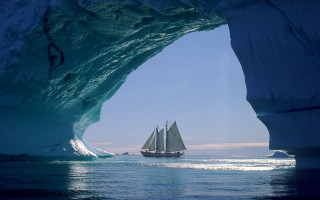 Sailboat iceberg ocean blue sky - surrealism free wallpaper