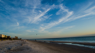 Beach people buildings blue sky - a few building free wallpaper