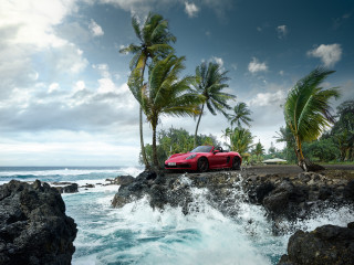Red sports car rocky shore - wave free wallpaper