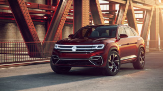 Red volkswagen suv bridge city - a bridge in the background free wallpaper