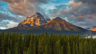 Mountain forest cloudy sky sunset - a forest below free wallpaper