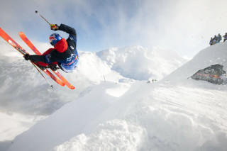 Skier midair ramp snow mountain - round free wallpaper