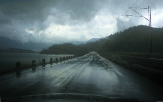 Gloomy road water power lines - a bunch of water free wallpaper