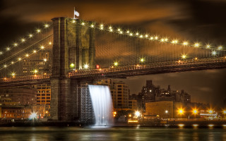 Bridge waterfall night lights city - free rain wallpaper