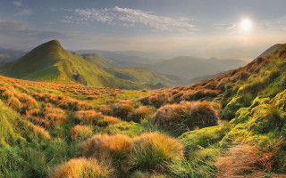 Grassy valley mountain sunset clouds 2 - field free wallpaper for desktop