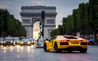 Yellow sports car paris triumph - the street in front free wallpaper