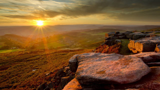 Sunset rocky hillside large rock - arthur quartley free wallpaper