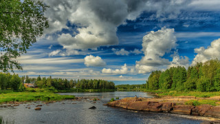 River rocks trees cloudy sky - a cloudy sky above free wallpaper