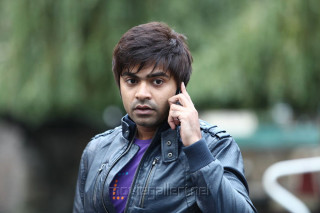 Man leather jacket cell phone 3 - a park area free wallpaper