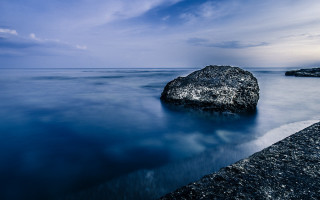 Rock water pier cloudy sky - a cloudy day free wallpaper
