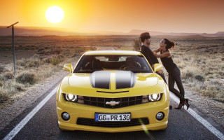 Couple kissing yellowcar sunset beach - the background and a woman free wallpaper