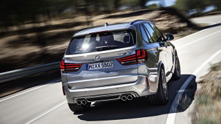 Silver bmw suv driving forest - a road next free wallpaper