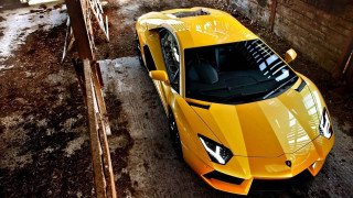 Yellow sports car garage brick 2 - a wooden fence free wallpaper