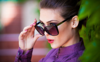 Woman sunglasses purple shirt adjusting 2 - a purple shirt free wallpaper