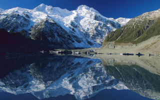 Mountain lake reflection fantasy landscape - a mountain range free wallpaper