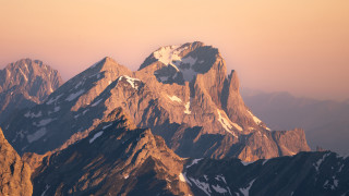 Mountain range snow pink sky - a mountain range free wallpaper