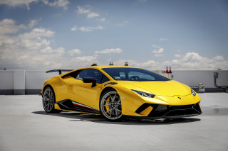 Yellow sports car cloudy sky - a parking lot free wallpaper