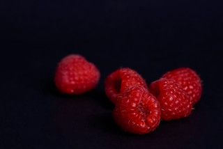 Three raspberries black background macro - the bottom free wallpaper for desktop