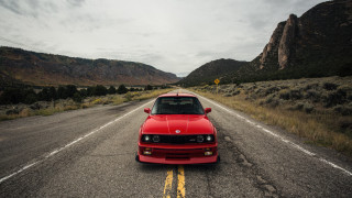 Mountain road red car nature - bernie d’andrea free wallpaper