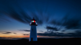 Lighthouse red light night clouds - free light wallpaper for desktop