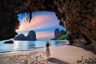 Woman beach cave ocean mountains - a cave free wallpaper
