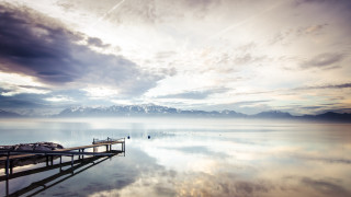 Lake mountains dock clouds sunset - a body of water below free wallpaper