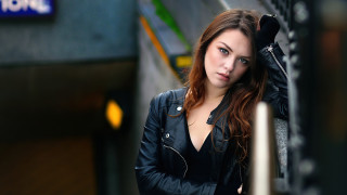Woman leaning wall black leather - free other wallpaper