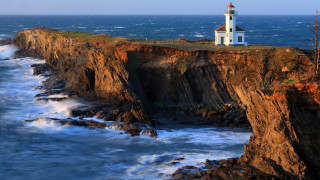 Lighthouse cliff ocean waves beach - wave free wallpaper for desktop
