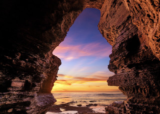 Sunset cave beach ocean rocky - a rocky shore free wallpaper
