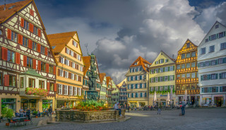 City square fountain architecture skyline - a city square free wallpaper