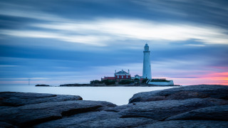 Lighthouse rocky shore sunset cloudy - a rocky shore free wallpaper