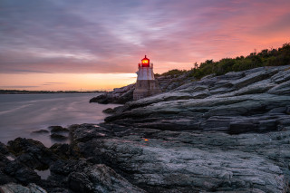 Lighthouse rocky shore sunset water 4 - a rocky shore free wallpaper