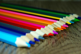 Colored pencils wooden surface blurry - a childs free wallpaper