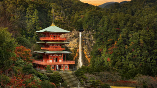 Tall red building waterfall forest - a waterfall in the background and trees free wallpaper