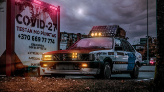 Policecar cyberpunk retrofuturism postapocalyptic cityscape - roof free wallpaper