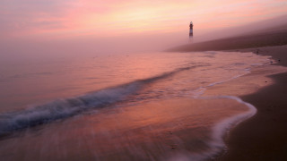 Beach lighthouse wave pink sky - mist free wallpaper