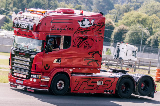 Red truck dragon city street - a red semi truck free wallpaper