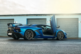 Blue sports car garage open 2 - andrew law free wallpaper